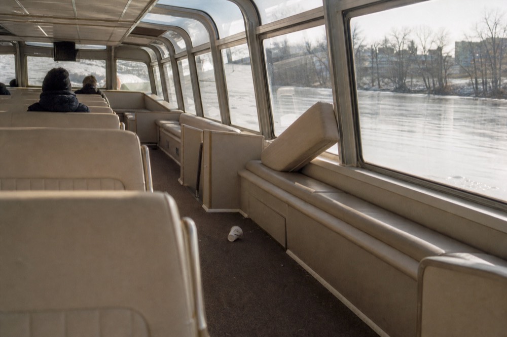 Seine cruise boat interior with panoramic windows, no text, no logos, no people